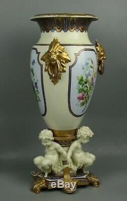 23 19C French hand painted porcelain Vase with Three Cherubs