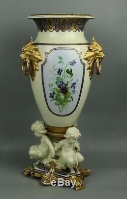 23 19C French hand painted porcelain Vase with Three Cherubs