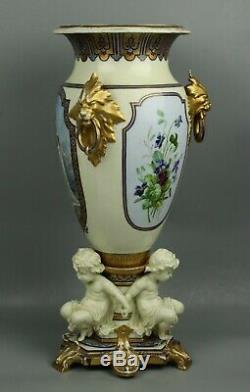 23 19C French hand painted porcelain Vase with Three Cherubs