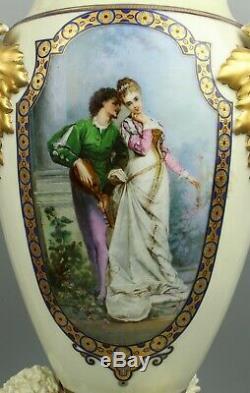 23 19C French hand painted porcelain Vase with Three Cherubs