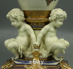 23 19C French hand painted porcelain Vase with Three Cherubs