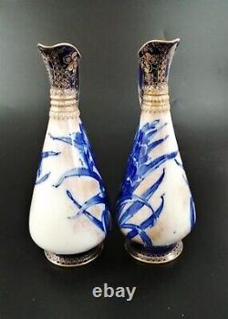 A pair of Royal Doulton Burslem ewer with Blue Iris, c. 1880