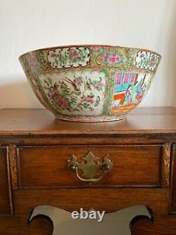 A substantial 19thC 38cm Canton punch bowl famille rose painted medallion images