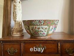 A substantial 19thC 38cm Canton punch bowl famille rose painted medallion images