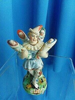 Antique Harlequin 1850 hand painted porcelain fertility figurine KINDERBRINGER