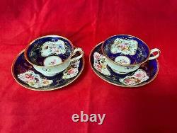 Antique Minton cobalt blue cup and saucer duo, hand painted flowers