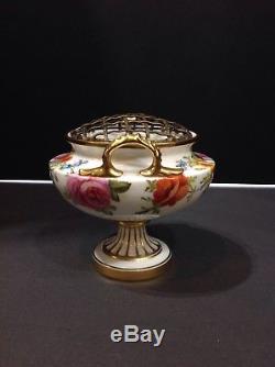 Cauldon porcelain cache pot. Artist signed Harrison. Handpainted florals. Brass