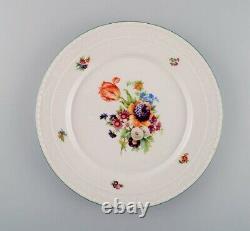 KPM, Berlin. Five antique porcelain plates with hand-painted flowers