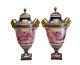 Pair Sevres France Porcelain Hand Painted Urns, C1900. Signed Perrot. Ram Heads