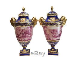 Pair Sevres France Porcelain Hand Painted Urns, c1900. Signed Perrot. Ram Heads
