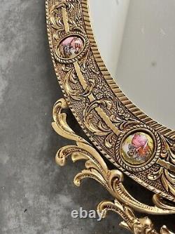 Vintage gilt oval Mirror Featuring Hand painted Porcelain Miniatures