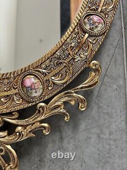 Vintage gilt oval Mirror Featuring Hand painted Porcelain Miniatures